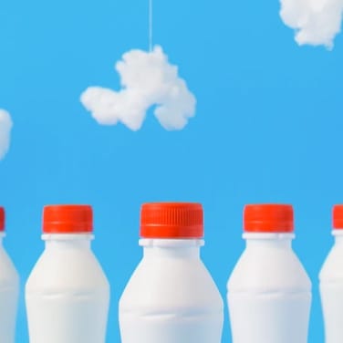 milk bottles with blue sky